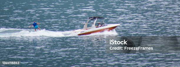 Aerial View Of Water Skier From A Distance On Lake Como Italy Stock Photo - Download Image Now