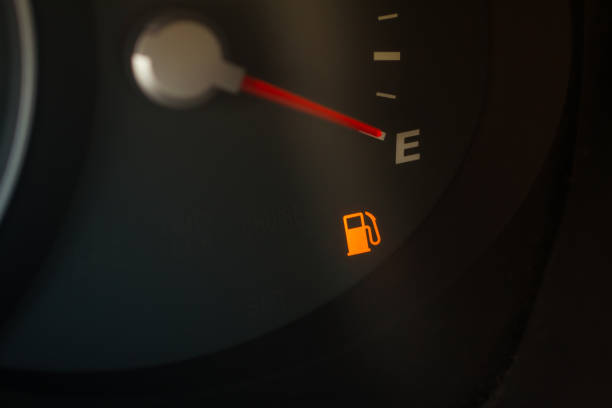 istock Empty fuel gauge warning light in car dashboard close up view. Fuel indicator at empty position. 1344118948