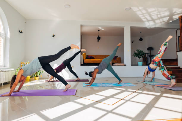 istock Advanced yoga class, at the cozy and modern yoga studio 1344119581