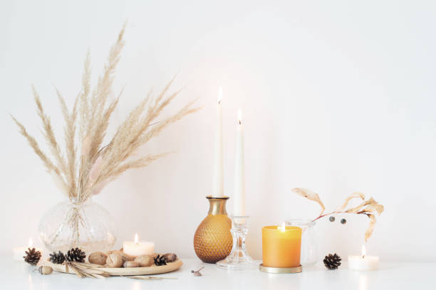 istock autumn home decorations with burning candles 1344119661