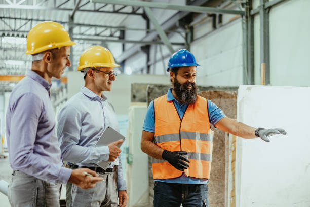 istock Employees in factory having meeting 1344121032