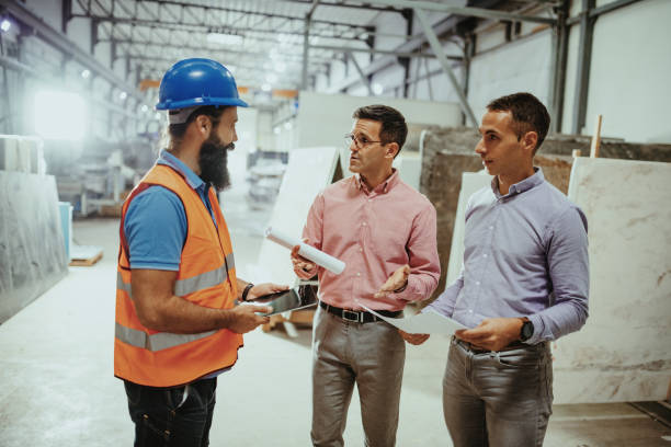 istock Developing new project with engineers and architects in factory hall 1344122388