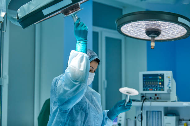 istock Surgery. The operating sister adjusts the light over the operating table 1344122628