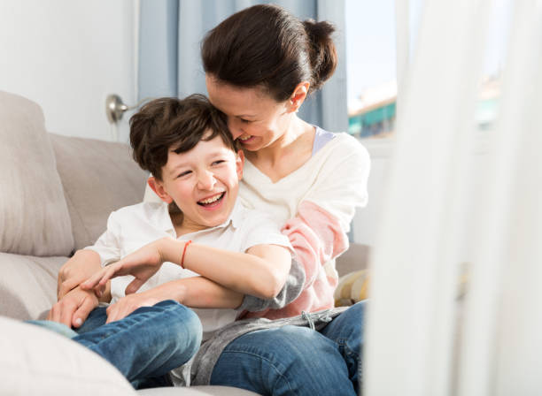 istock Happy woman hugging son 1344124390