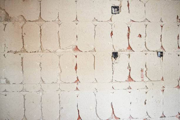 istock Cement tiled on bricks on a wall of a house under construction 1344127092