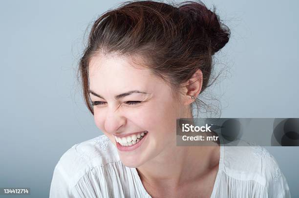 Portrait Of Smiling Young Woman With Brown Hair Stock Photo - Download Image Now - Smiling, Laughing, Dentist