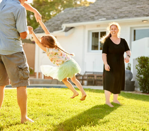 istock Family playing in their backyard 1344131986