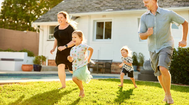 istock Playful family having running race in backyard 1344132566