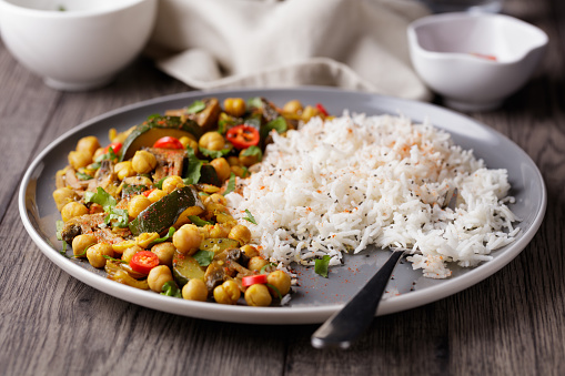 Homemade freshness chickpea, courgette, and mushroom with basmati rice, serve with chopped fresh coriander and chia seeds
