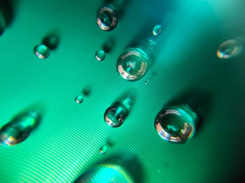 countless small and some larger air bubbles in a thick green liquid