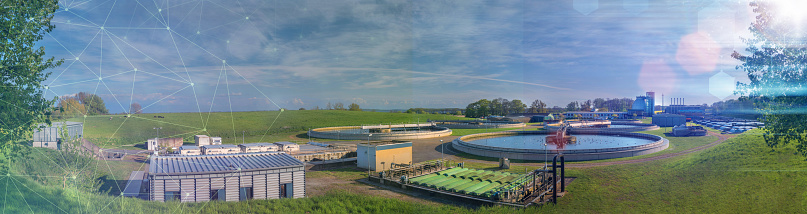 Panorama of sewage treatment plant with future icons and dynamic symbols.