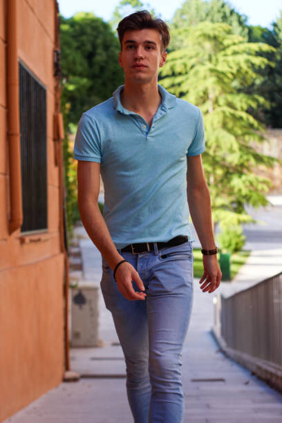 istock Vertical portrait of young man walking 1344138172