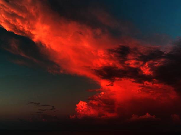istock Fiery red clouds on the night sunset sky. 1344139245
