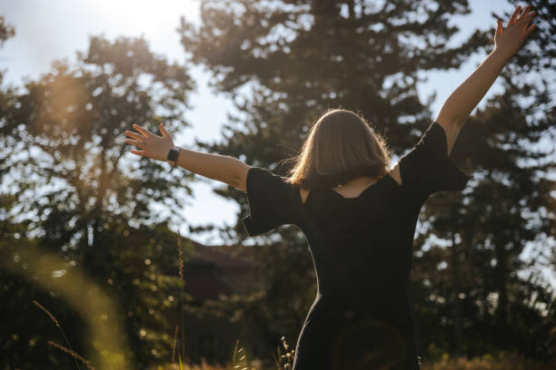 istock Young woman feeling free in nature 1344146470