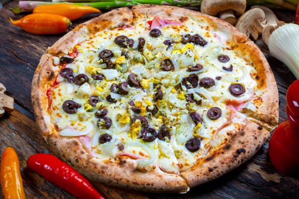 istock Portuguese Pizza, onion, peppers, pepperoni, egg, olive 1344147646