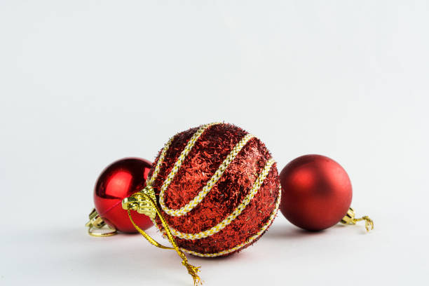 Christmas ornament isolated on white background. Polka dots to hang on Christmas trees to celebrate the arrival of Santa Claus. Red ball stock photo