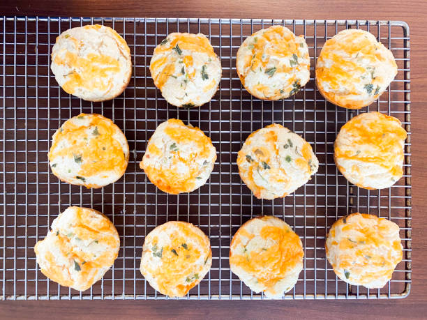 istock Homemade Fresh Cheese Biscuits On A Cooling Rack 1344153518