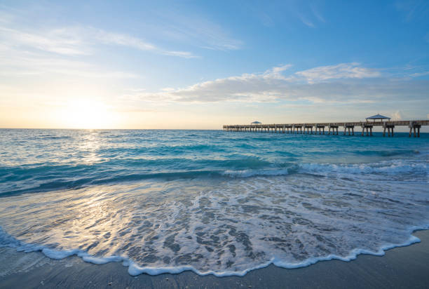 istock Beautiful sunrise over a pier on the Atlantic ocean. 1344155129