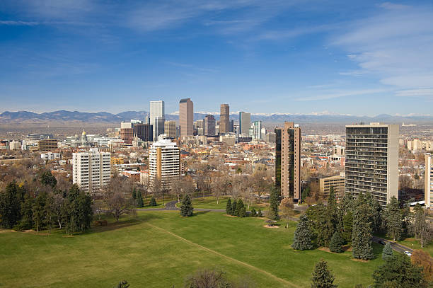 Denver Colorado Skyline and Green Cheeseman Park Denver Colorado Skyline and Green Cheeseman Park.  View of Denver Colorado Skyline.  Looking at city with mountains in background.  Converted from 14-bit Raw file.  sRGB color space. civic center park stock pictures, royalty-free photos & images