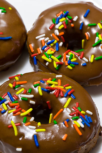 istock Chocolate Donuts with Colorful Rainbow Sprinkles 134415885