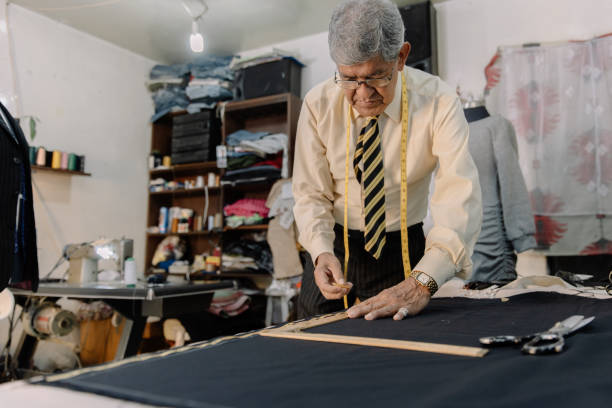 istock experienced mexican tailor working on local business 1344159110