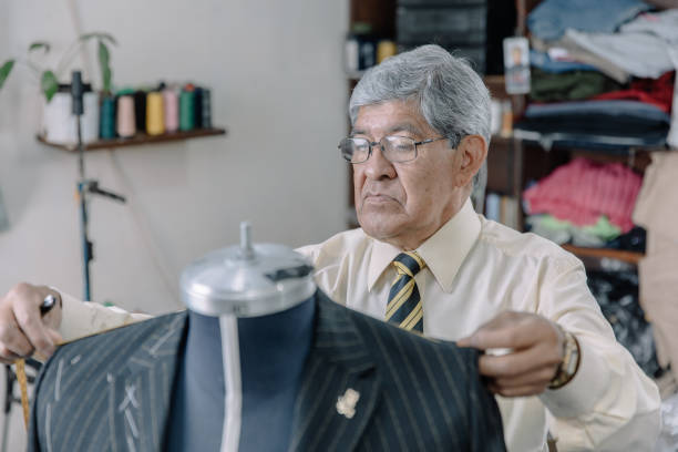 istock Mexican tailor taking measurements in his workshop 1344160185