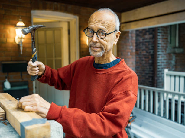 istock Senior man doing carpentry outdoors 1344162839