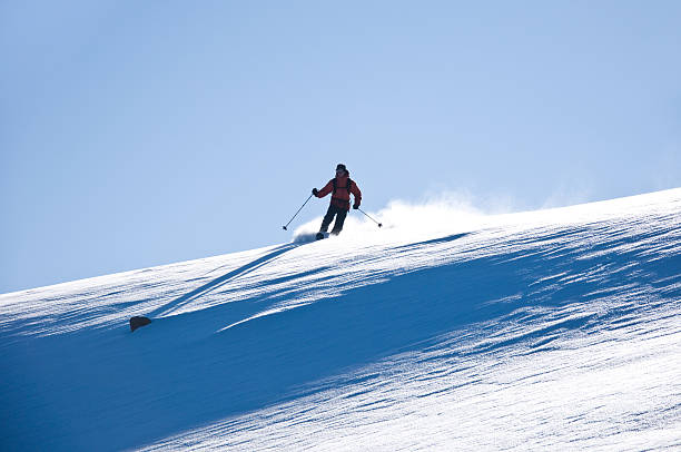 istock Skier Making Powder Turns in Mountain Backcountry 134416331