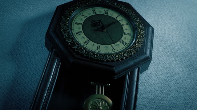 Old Wall Clock In The Dark Angled Shot