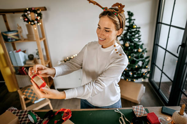 istock Woman with a Christmas gift 1344184489