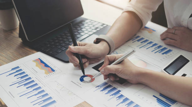istock Investment and cooperate concept, business financial inspector analyzing about performance data in office meeting. 1344184516