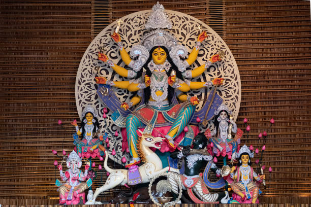 Goddess Durga idol decorated at puja pandal in Kolkata, West Bengal, India. Durga Puja is biggest religious festival of Hinduism and is now celebrated worldwide. stock photo