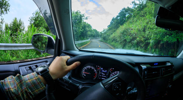 istock People driving car on morning mountain road 1344188630