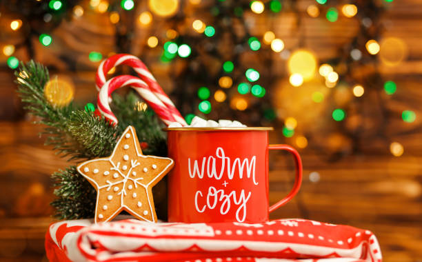 istock Festive bokeh. Christmas mug with hot drink and candy cane. 1344192406