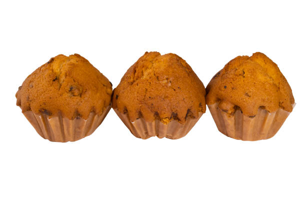 three cupcakes isolated on a white background. - baked bread breakfast brown imagens e fotografias de stock