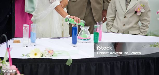 Bride And Groom Pouring Sand As Sign Of Commitment Stock Photo - Download Image Now - Bride, Ceremony, Color Image
