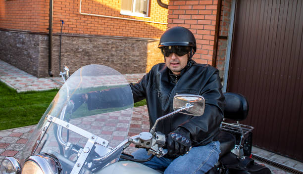 istock Motorcycle man in jacket and helmet, biker 1344199631