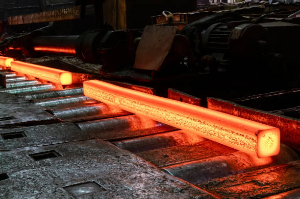 istock Red-hot metal billet on the roller table of a rolling mill 1344203199