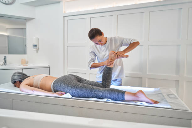 istock Competent female therapist doing foot rehabilitation massage 1344205047