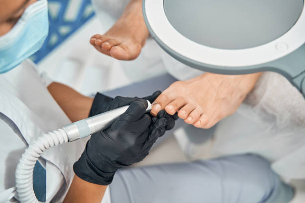 istock Focused photo on specialist working with nail drill 1344208030