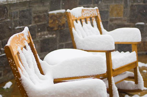 istock Snow Covered Chairs and Fresh Snowflakes Falling 134420835