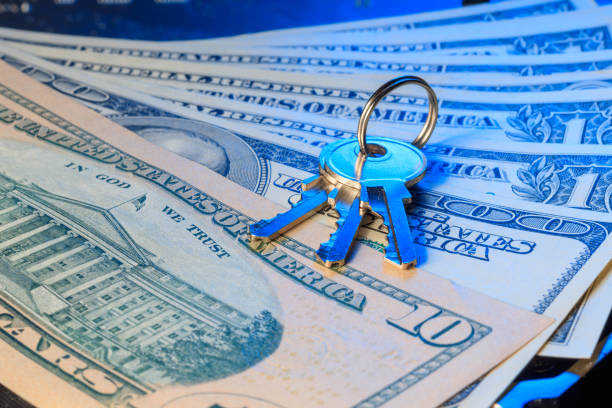 istock The keys on a background of money. Selective focus. 1344209925