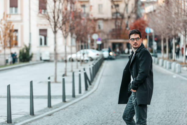 istock Handsome man in fashinable outfit walking. 1344210083