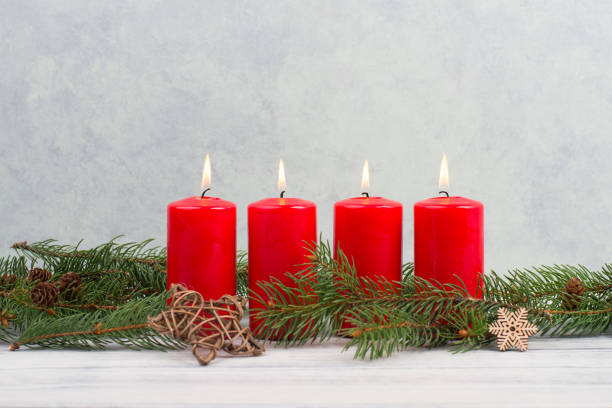 istock Red candles on a advent wreath, christmas decoration with candlelight 1344210270