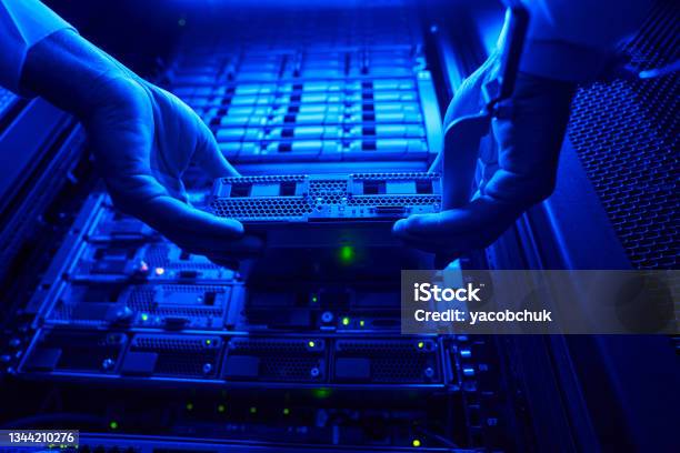 Unrecognized It Engineer Find And Troubleshooting Server Computer In Data Center Stock Photo - Download Image Now