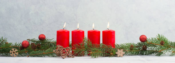 istock Red candles on a advent wreath, christmas decoration with candlelight 1344210281