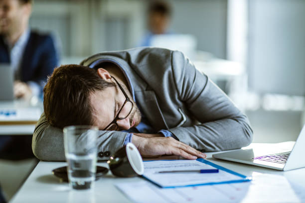 istock Exhausted male entrepreneur taking a nap in the office. 1344210813