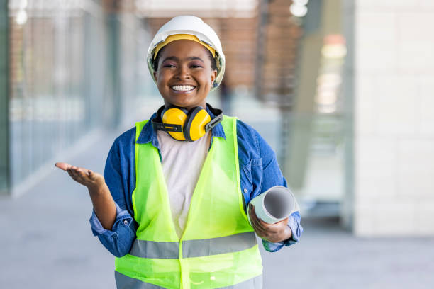 istock Portrait of architect standing at building site and looking at camera with copy space. 1344213358