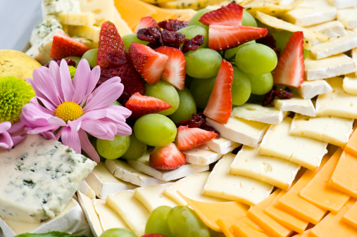 Cheese and Fruit Tray Platter.  Imported cheeses and fresh fruit appetizer display.  Prepared by world class chef.  ProPhoto RGB.