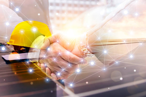 istock Electrical Engineer Technician Talk to business people to invest in install solar cells outside building or industrial factory. 1344214113